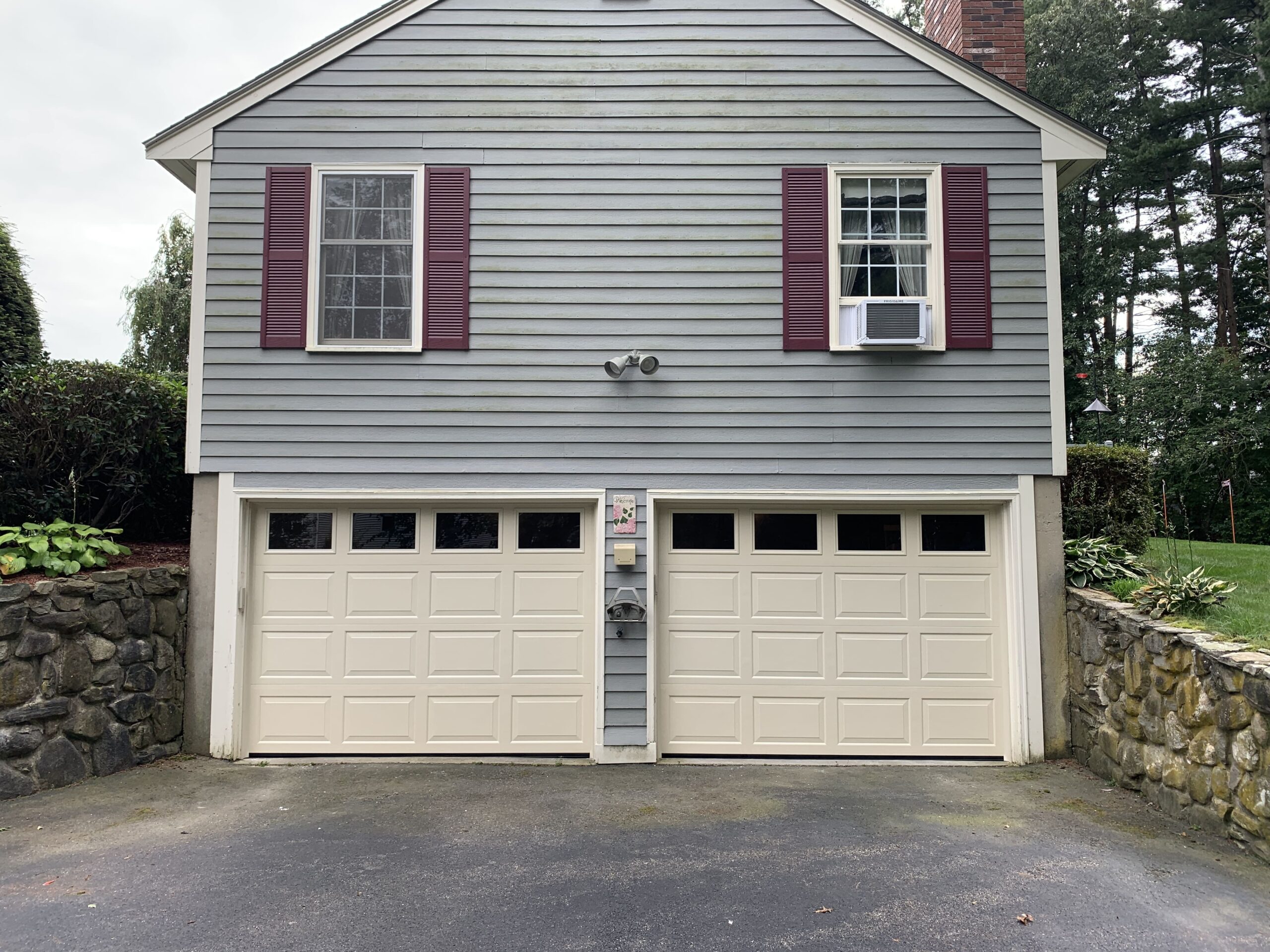 steel cream garage doors on home