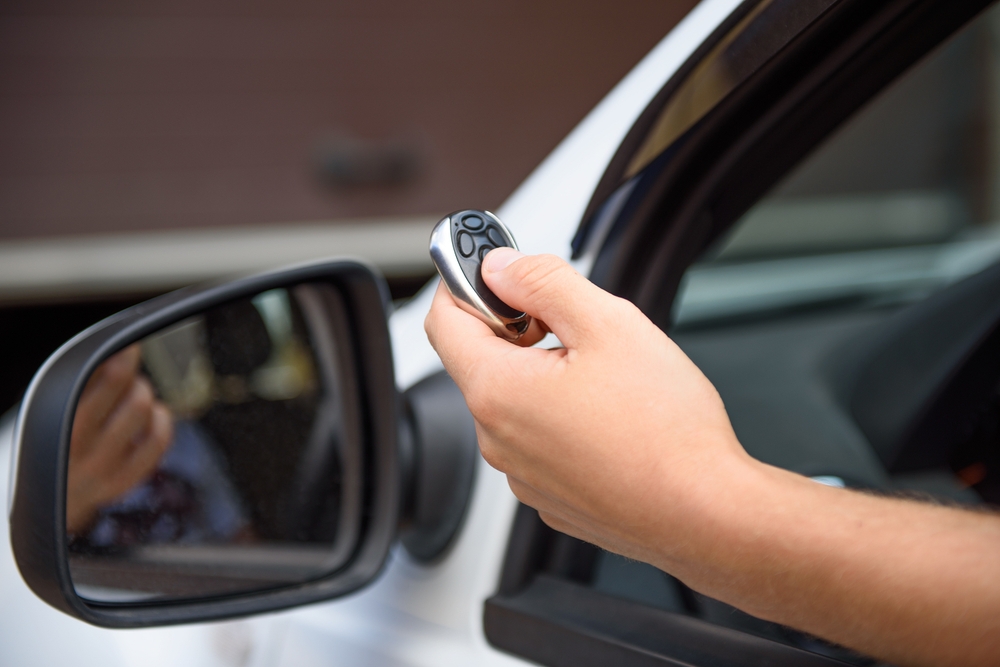 Man with garage door opener